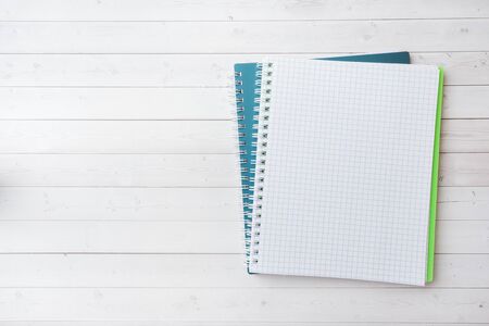 Clean white notebook and pencil with copy space on white table background for presentation, writer or school education, blogger, novel and friction or brand story conceptの写真素材