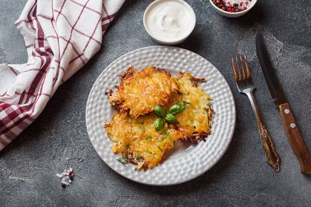 Fried cakes of grated potatoes on the plate with sauce. Traditional pancakes boxty raggmunk.の写真素材