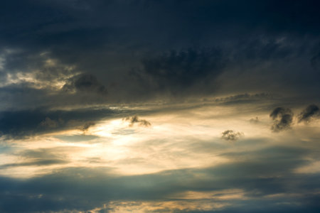 Sunset breaks through the dark clouds. Texture sky,