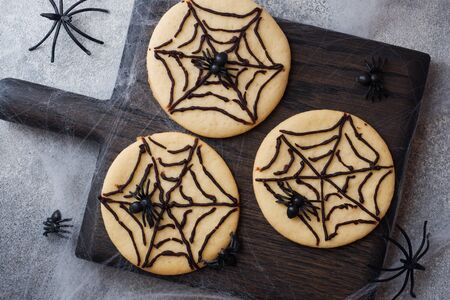 Homemade cookies for Halloween. Cookies with chocolate web and spidersの写真素材