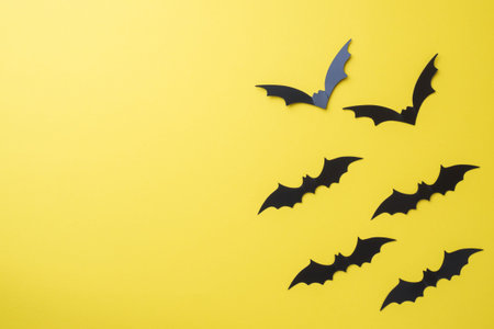 Scenery bats on a yellow background. Concept Halloween
