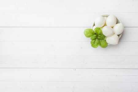 Mozzarella balls and Basil in the dish, selective focus. Copy spaceの写真素材