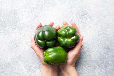 Fresh sweet green pepper on a grey concreteの写真素材