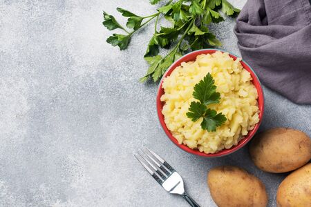 Homemade cream mashed potatoes in a dish with parsley copy spaceの写真素材