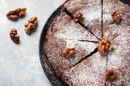 Homemade chocolate brownie with walnuts. Baking chocolate cake copy space