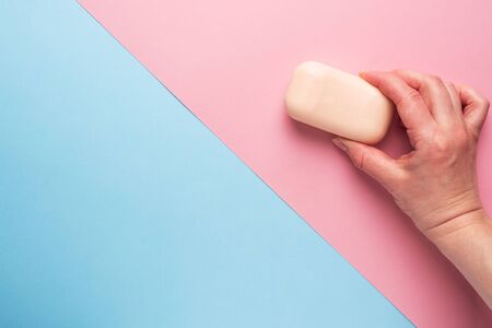 Natural soap on a pink blue background. Flat lay the concept of Spa cleanliness of hands. copy spaceの写真素材