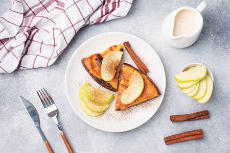 Cottage cheese casserole with apples and cinnamon spices. Concept of a healthy Breakfast.の写真素材