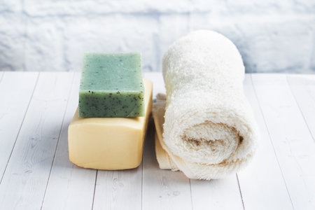 Concept SPA and Wellness. Massage brush, cosmetic oils and soap. Light background Copy space