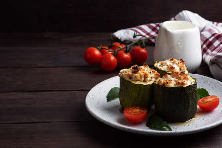 Raw zucchini is prepared for stuffing with minced chicken and vegetablesの写真素材