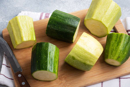 Raw zucchini is prepared for stuffing with minced chicken and vegetablesの写真素材