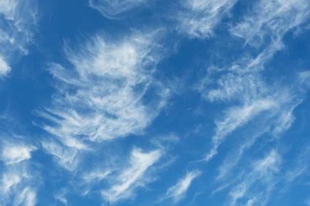 White Cirrus clouds in a blue sky. Close up sky with clouds,
