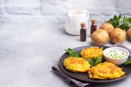 Fried cakes of grated potatoes on the plate with sauce. Traditional pancakes boxty raggmunkの写真素材