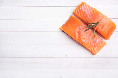 Salmon fillet, red salted fish on a white table Copy space.の写真素材