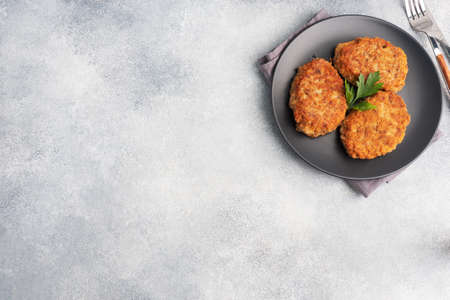 Buckwheat cutlets with cheese and parsley on a plate Healthy diet food copy space, top view.の写真素材