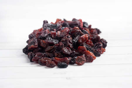 A handful of delicious dried raisins from dark grapesの写真素材