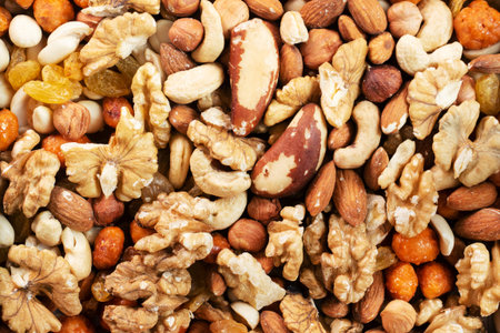 Background texture mixture of nuts and dried fruits. Concept of healthy vegetarian food. close up