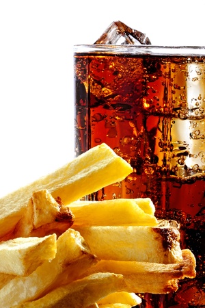 Cola with the ice in a glass and deep-fried potatoes, isolated on whiteの写真素材
