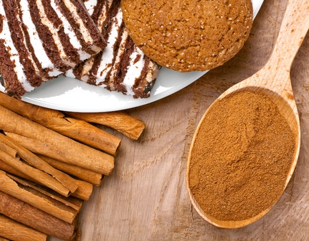 Cinnamon with sweets on the wood surfaceの写真素材