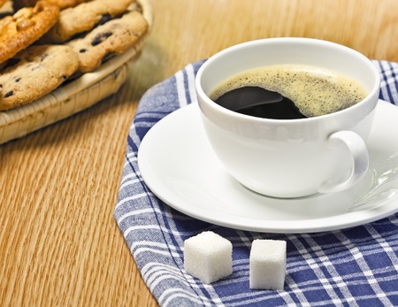 Coffee and cookies on the table, studio shotの写真素材