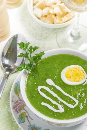 Cream soup with egg, sour cream and wine on the table, studio shotの写真素材
