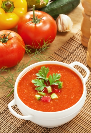 Gazpacho and ingredients on a table, vegetable soupの写真素材