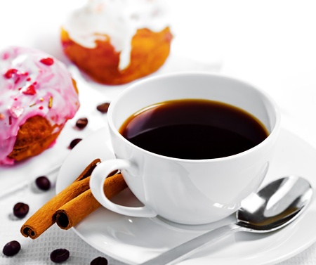 Cup of coffee and sweets on white backgroundの写真素材