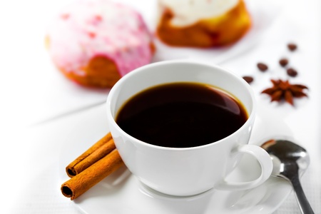 Cup of coffee and sweets on white backgroundの写真素材