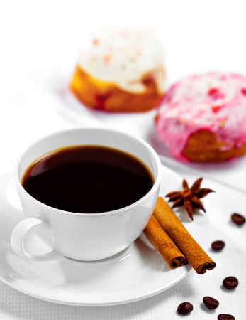Cup of coffee and sweets on white backgroundの写真素材