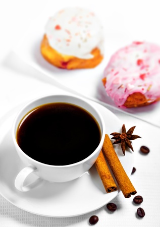 Cup of coffee and sweets on white backgroundの写真素材