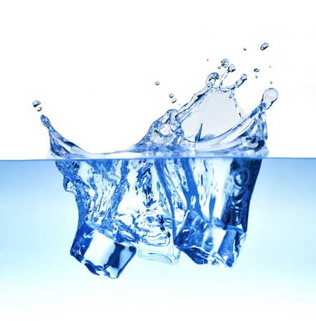 Ice-cube makes a water splashの写真素材