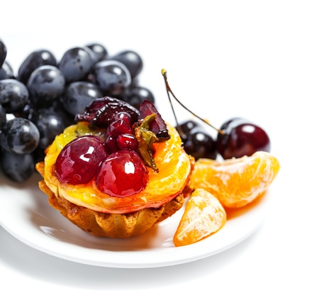 Sweet fruit cake isolated on whiteの写真素材