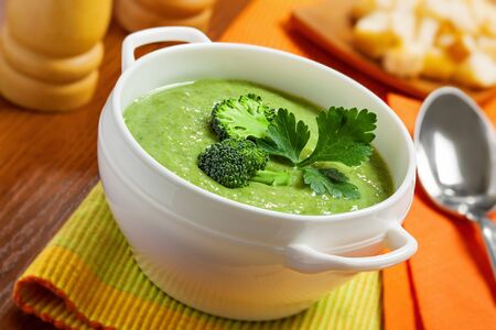 Broccoli cream soup on tableの写真素材