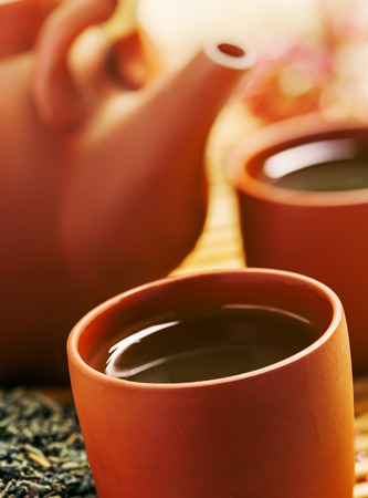 Green tea in Chinese cup and teapotの写真素材