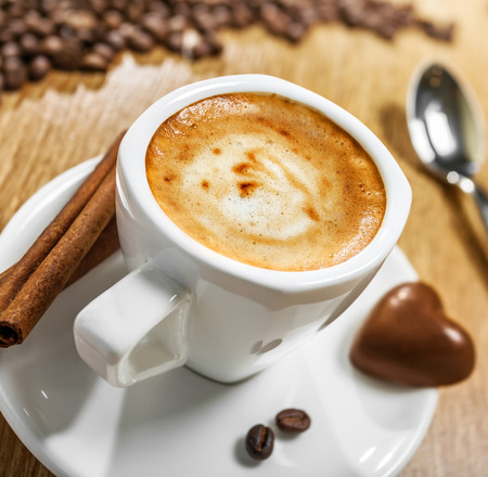 Cup of coffee with candy heart, love symbolの写真素材
