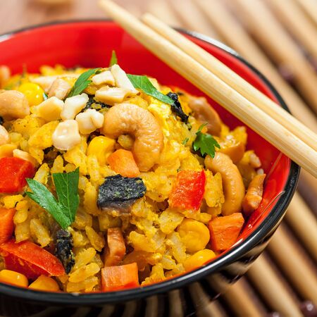 Fried rice with vegetables in bowl, close-upの写真素材