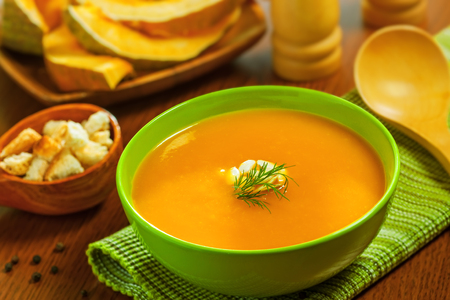 Pumpkin Soup with croutons on tableの写真素材