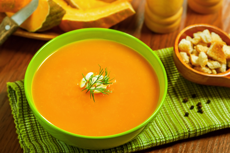 Pumpkin Soup with croutons on tableの写真素材