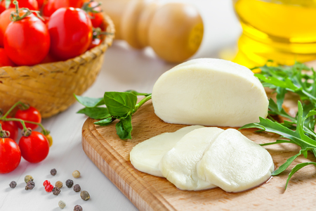 Cooking of salad with mozzarella and tomatoesの写真素材