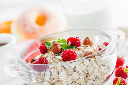 Oatmeal breakfast with coffee, muesli with fruits and nuts.の写真素材