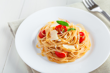 Pasta with tomato sauce, parmesan cheese and basil, Italian foodの写真素材