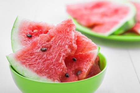 Fresh slices of watermelon in bowlの写真素材