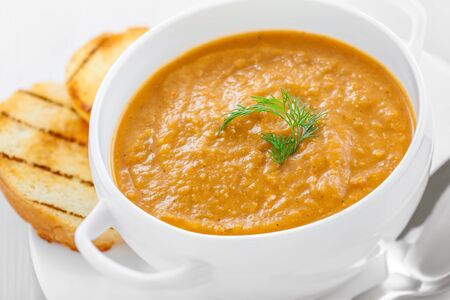 Lentil cream soup on white table, close-upの写真素材