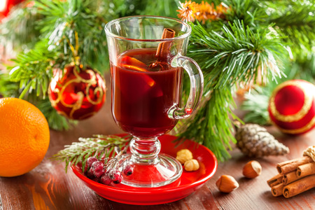Mulled wine with citrus fruits and cinnamon. Traditional winter hot drink for Christmas.の写真素材