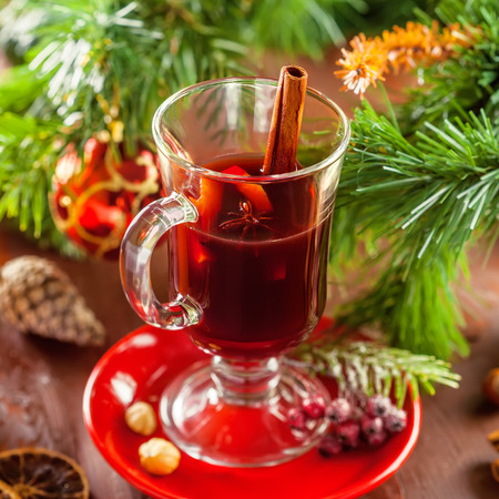 Mulled wine with citrus fruits and cinnamon. Traditional winter hot drink for Christmas.の写真素材