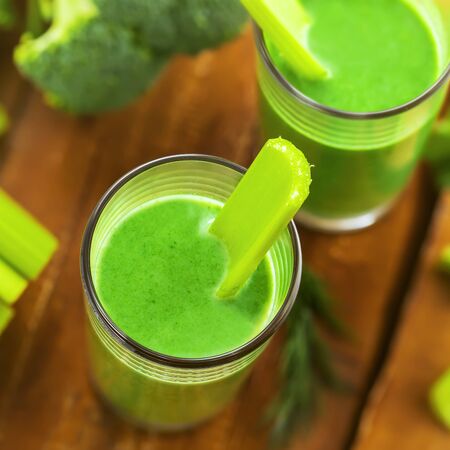 Delicious healthy drink, green smoothie made of celery and broccoli, top viewの写真素材