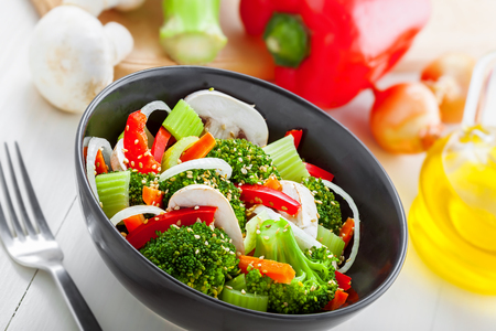 Steamed broccoli with vegetables. Vegetable salad in bowl. International healthy vegetarian food.の写真素材