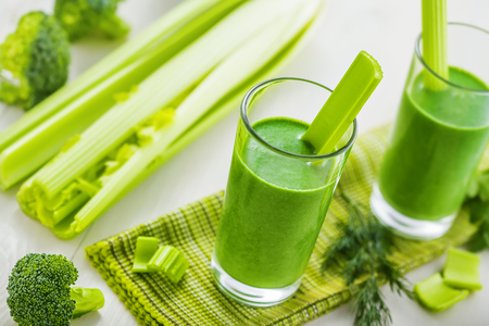 Delicious healthy drink, green smoothie made of celery and broccoliの写真素材