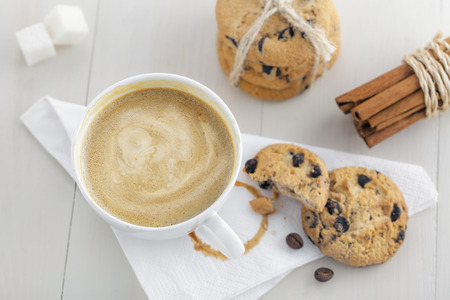 Chocolate baked biscuits with cup of coffee. Top view.の写真素材