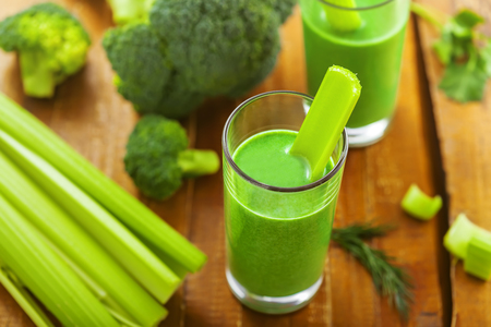 Delicious healthy drink, green smoothie made of celery and broccoliの写真素材