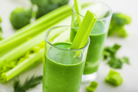Delicious healthy drink, green smoothie made of celery and broccoli, close-upの写真素材